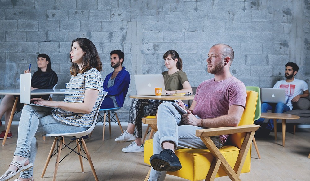 people taking notes in a classroom